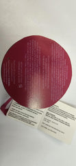 EXPRESSIONS tube next to a coin illustrating compact size