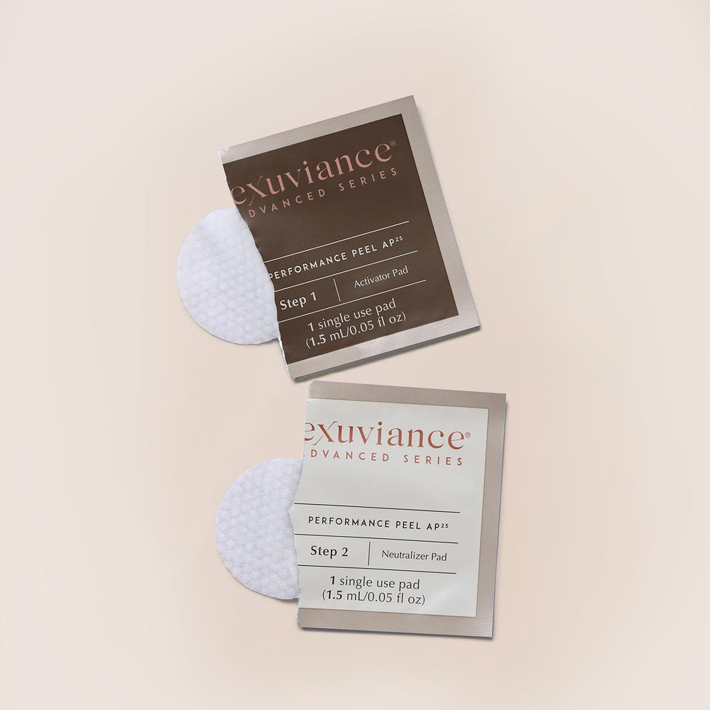EXUVIANCE on bathroom shelf suggesting a professional home routine