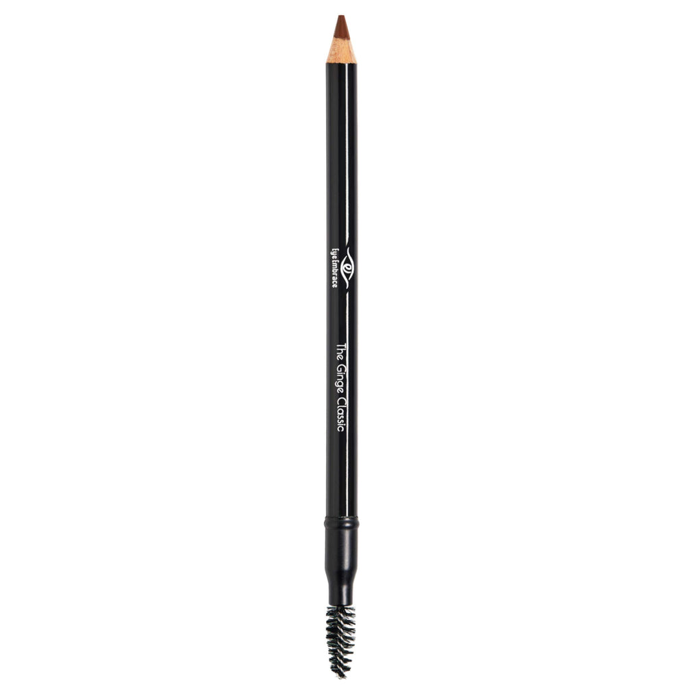 Eye Embrace pencil beside coin showing compact travel-friendly size