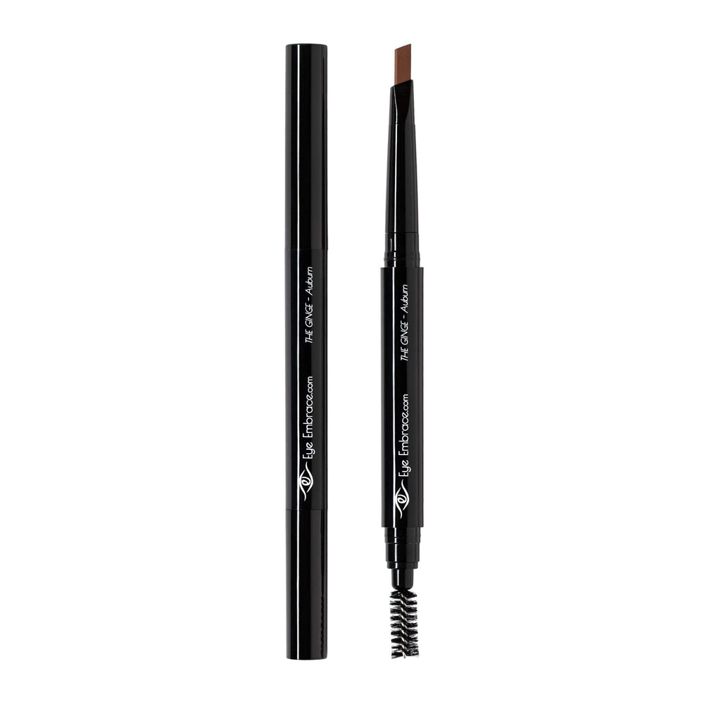 Eye Embrace pencil held in hand for scale, shows compact travel-friendly size