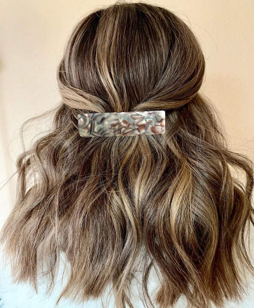 Eyegla lifestyle image of woman wearing barrettes for a polished everyday benefit