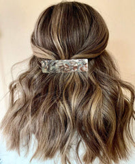 Eyegla lifestyle image of woman wearing barrettes for a polished everyday benefit
