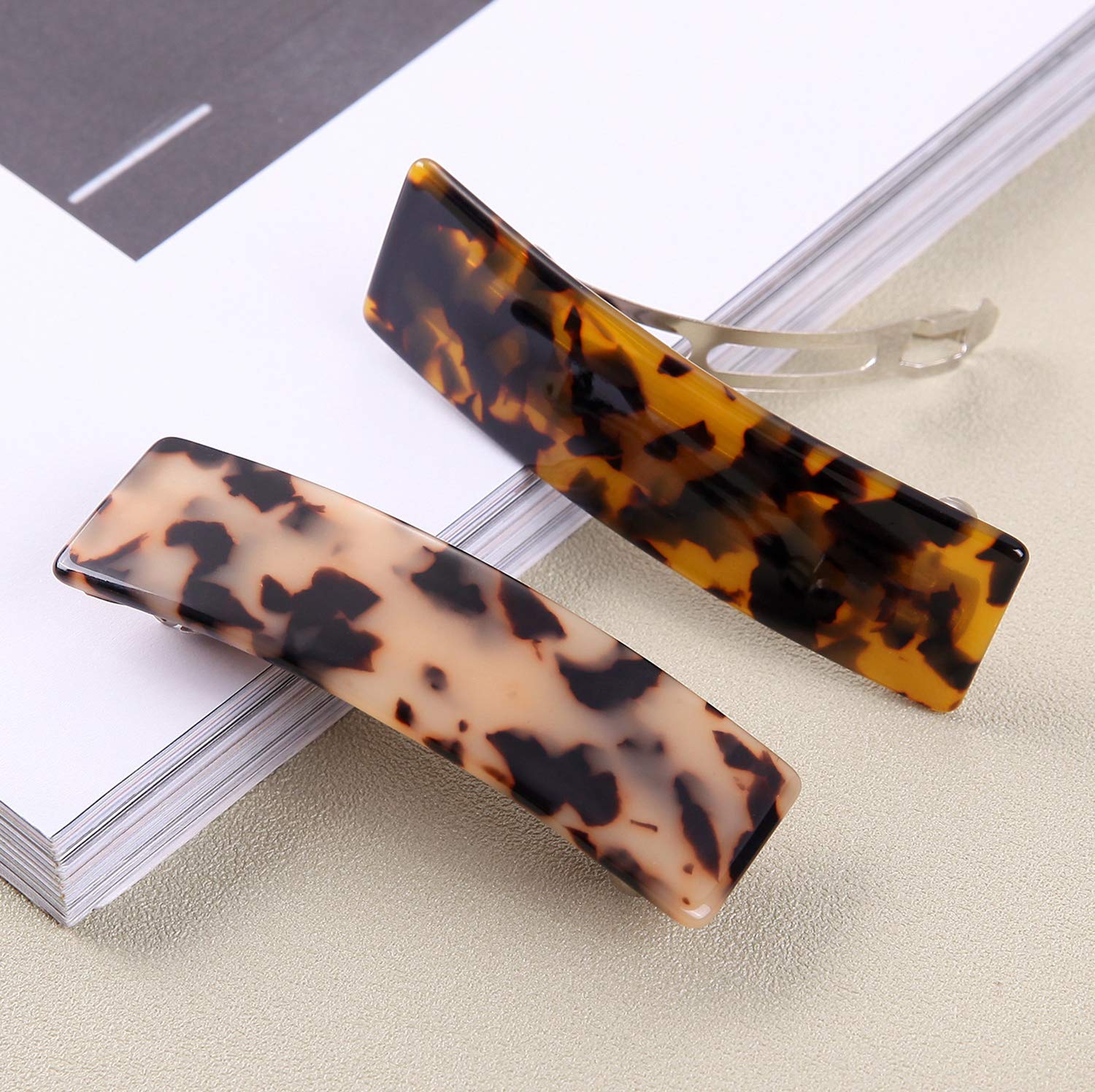 Eyegla barrette beside ruler showing 3.6 inch size for styling confidence