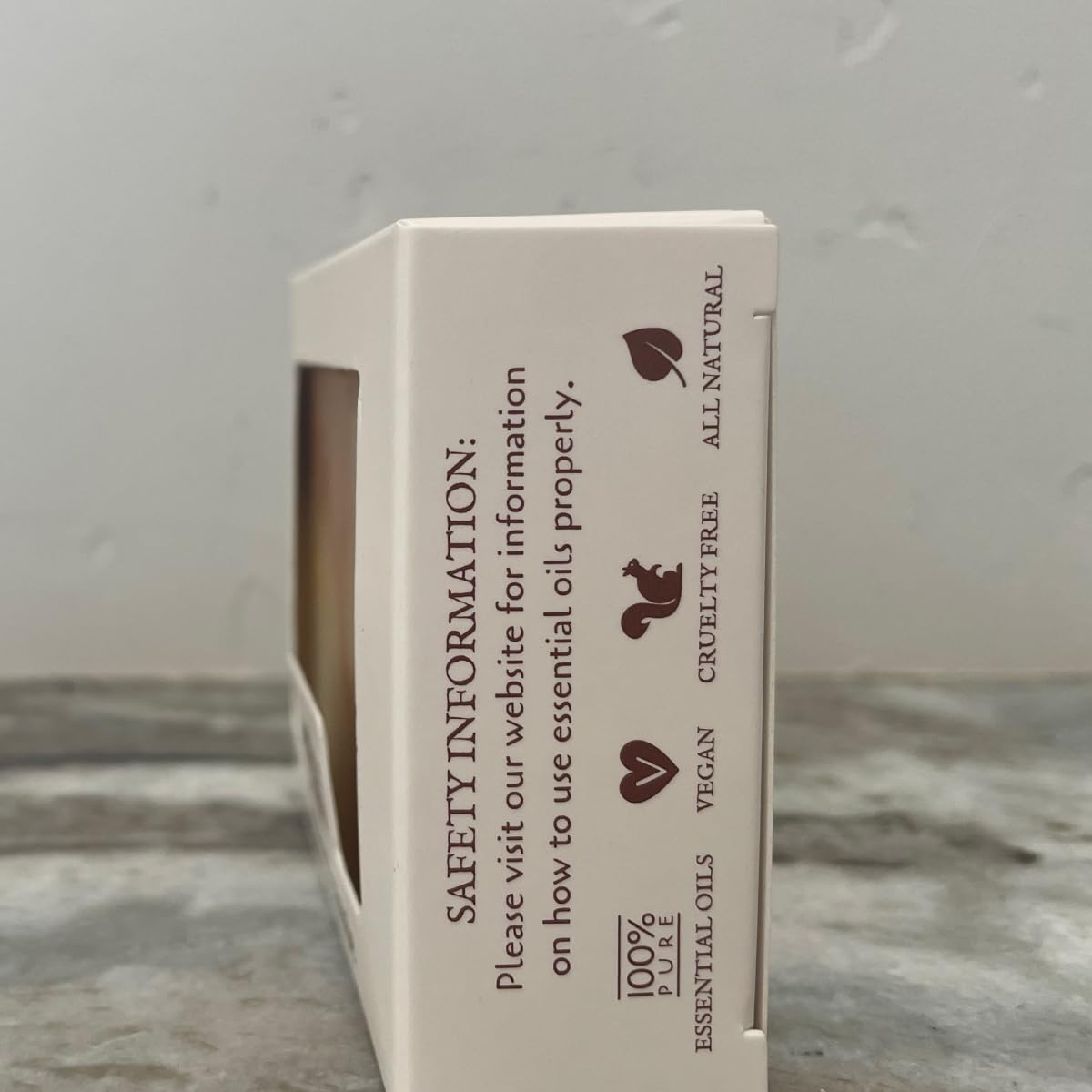Hand holding Fabulous Frannie 4 oz bar to show scale and convenient travel size benefit
