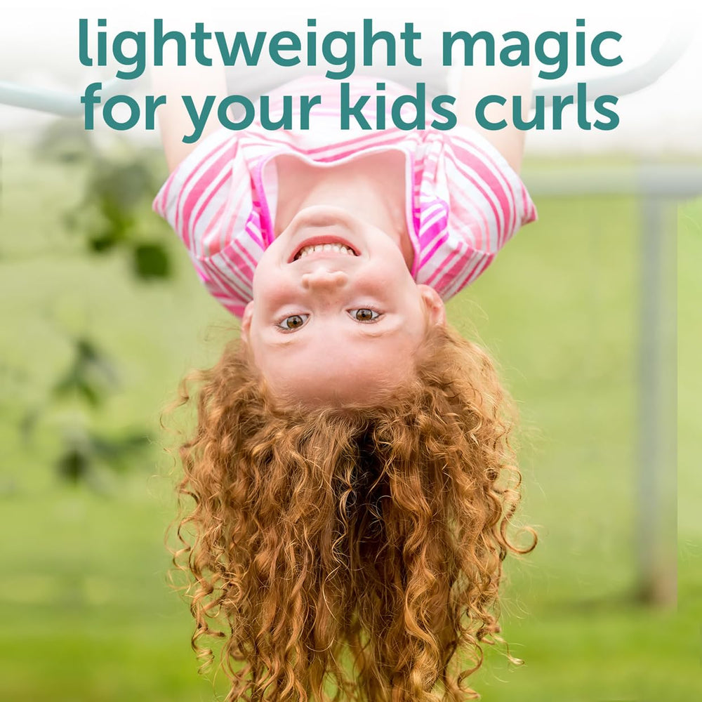 Fairy Tales child using curl refresher spray to revive bouncy curls