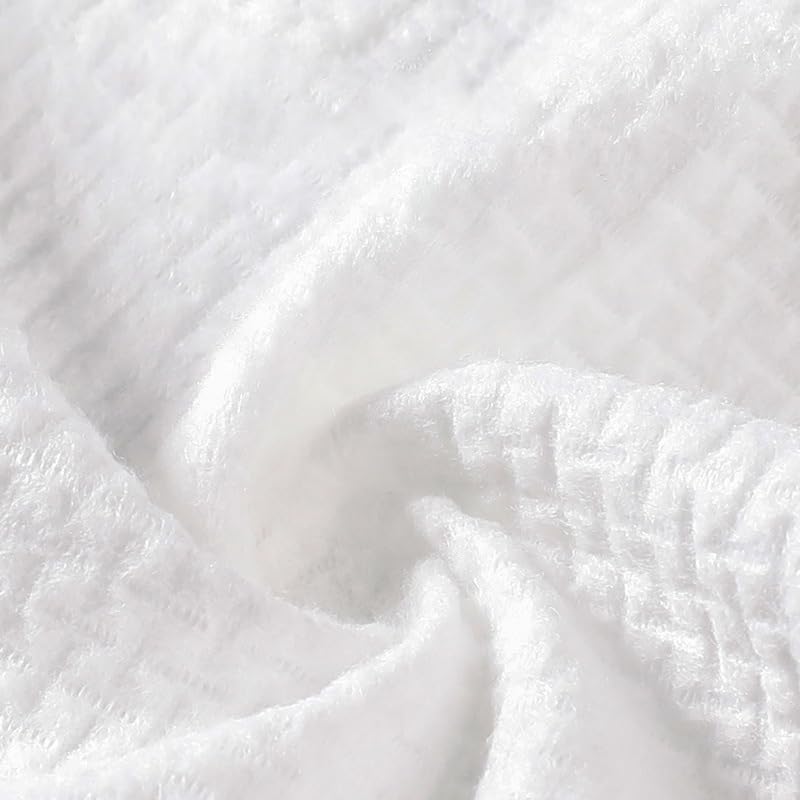 fancyou towel outdoors on grass near compost to illustrate biodegradability