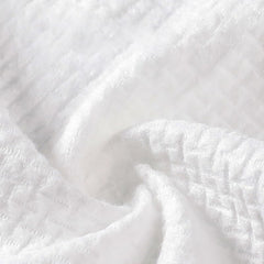 fancyou towel outdoors on grass near compost to illustrate biodegradability