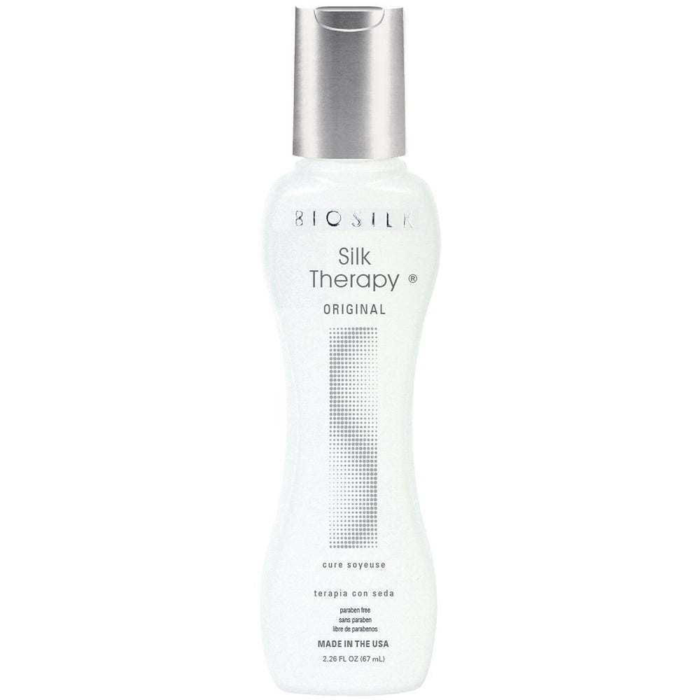 Hand holding BioSilk serum showing silky texture and instant smoothing benefit on hair