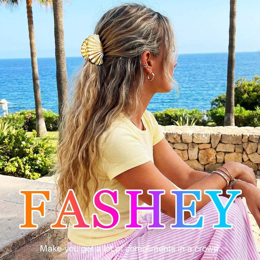 Fashey trio of gold clips styled on beach-themed tabletop for gifting inspiration