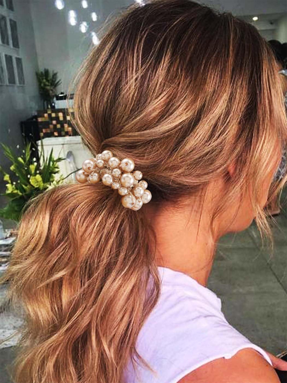 Fashey scrunchie worn as a wrist accessory offering portable style