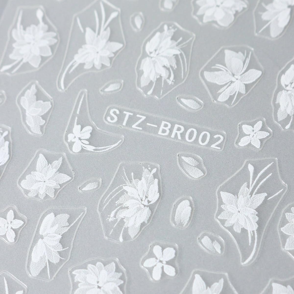 FBABFBUO decal sheet beside fingers to show scale and precise sizing benefit