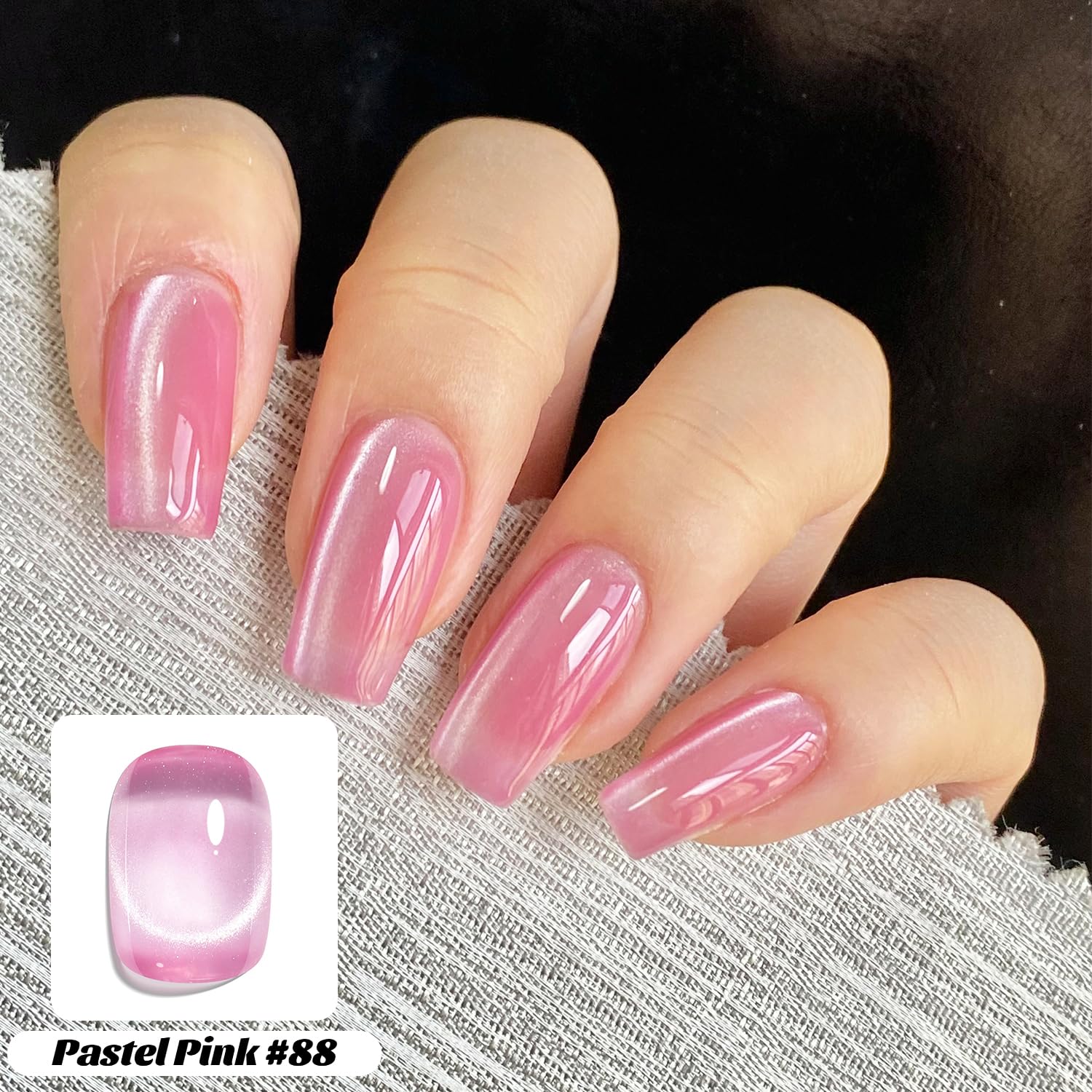 Fcozpjk magnet held above wet polish creating cat-eye line, demonstrates technique