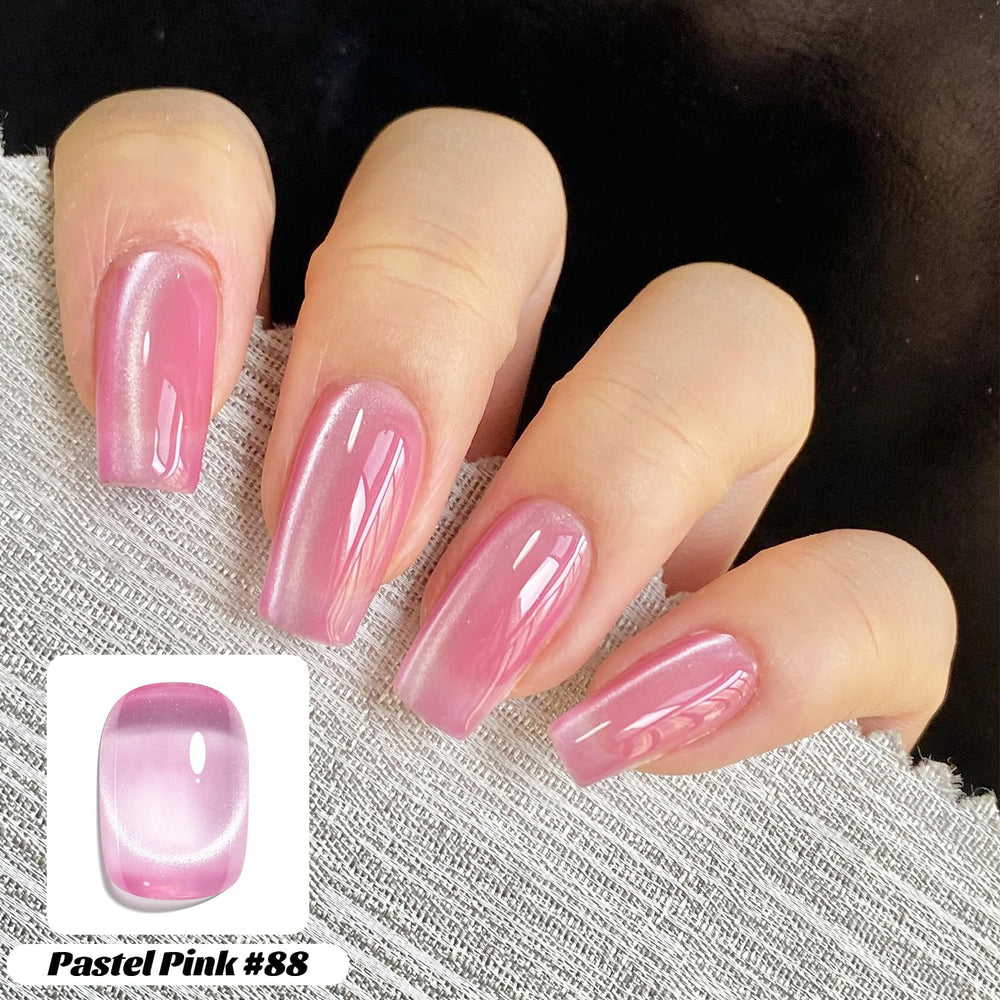 Fcozpjk magnet held above wet polish creating cat-eye line, demonstrates technique