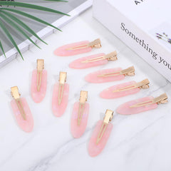FdcLixuvol clip holding bangs in place for makeup prep, convenient hands-free benefit