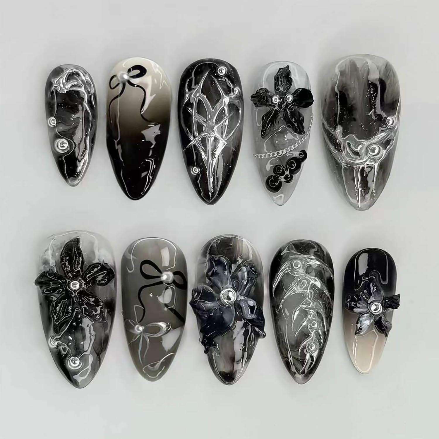 FDSQHSA front packaging showing black floral almond nails and benefits display