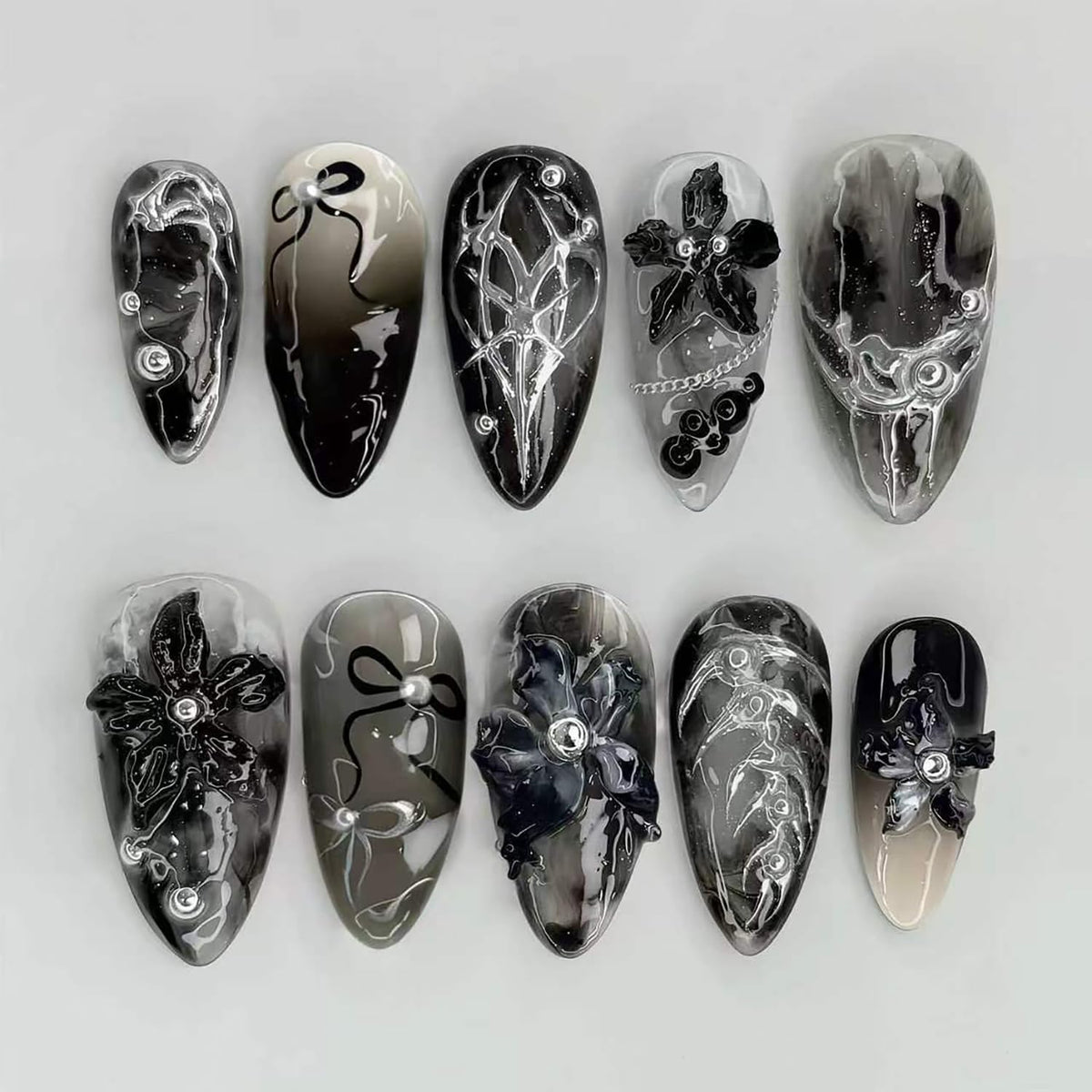 FDSQHSA front packaging showing black floral almond nails and benefits display