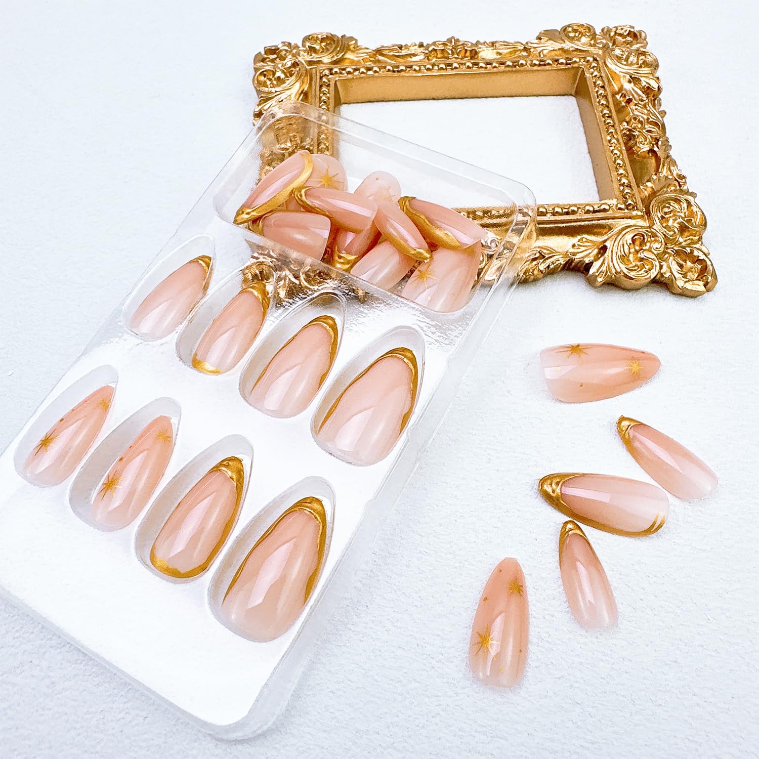 FDSQHSA hand holding a nail showing short almond scale for realistic fit preview