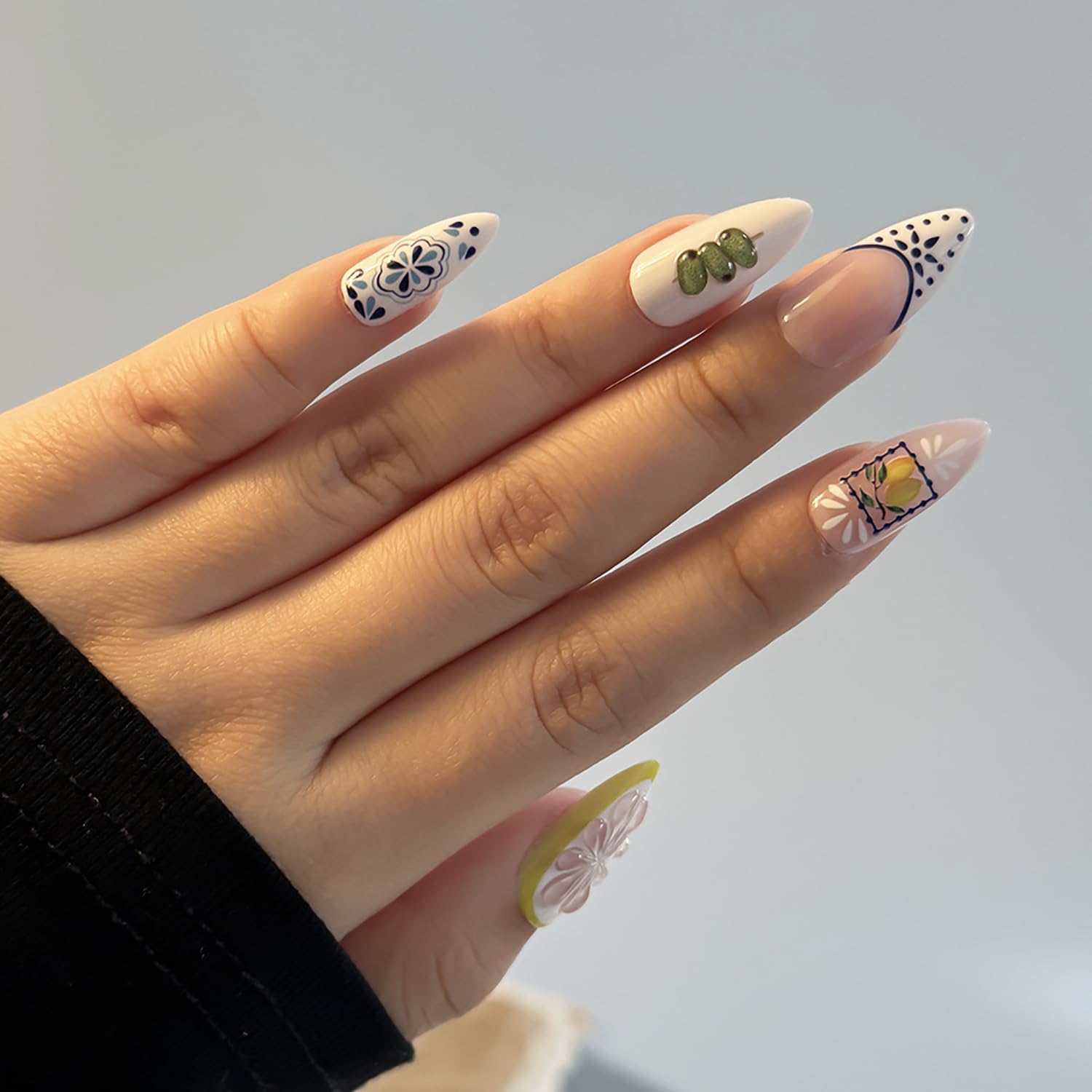 FDSQHSA size comparison next to natural nail demonstrating fit options