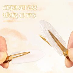 FEINIGESI clip holding bangs in place demonstrating crease-free hold during styling benefit