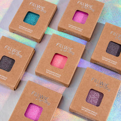 Fillwie pan beside coin showing compact size and convenient travel-friendly benefit