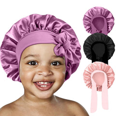 FIRSTPELLA front view of kids satin bonnet showing smooth finish and roomy fit