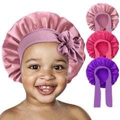FIRSTPELLA bonnet in bedroom on pillow illustrating sleep-time hair protection