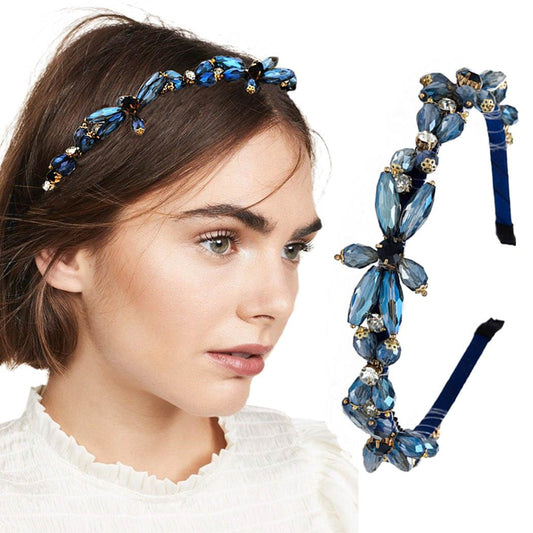 Firuilo front view of blue rhinestone headband showing shiny flower and comfortable fit