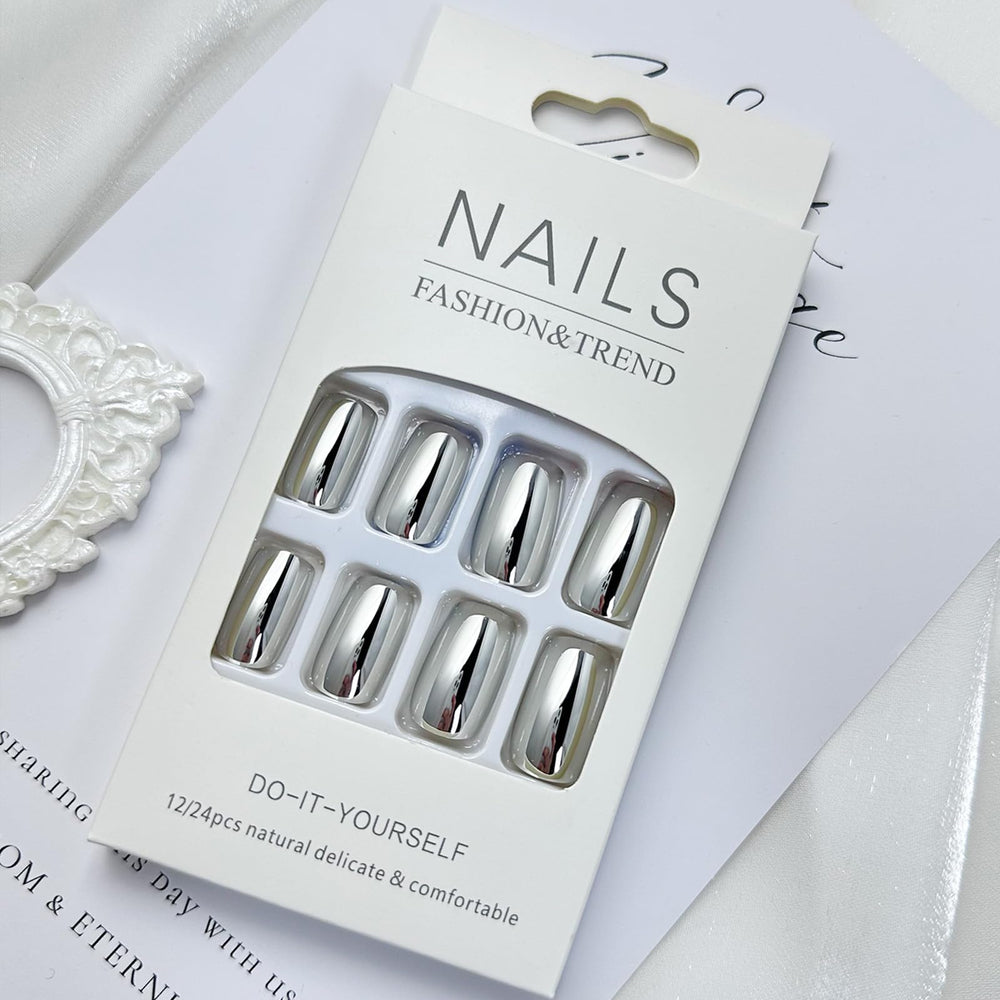 FJSMTOPl pressing a silver nail onto finger demonstrating quick application