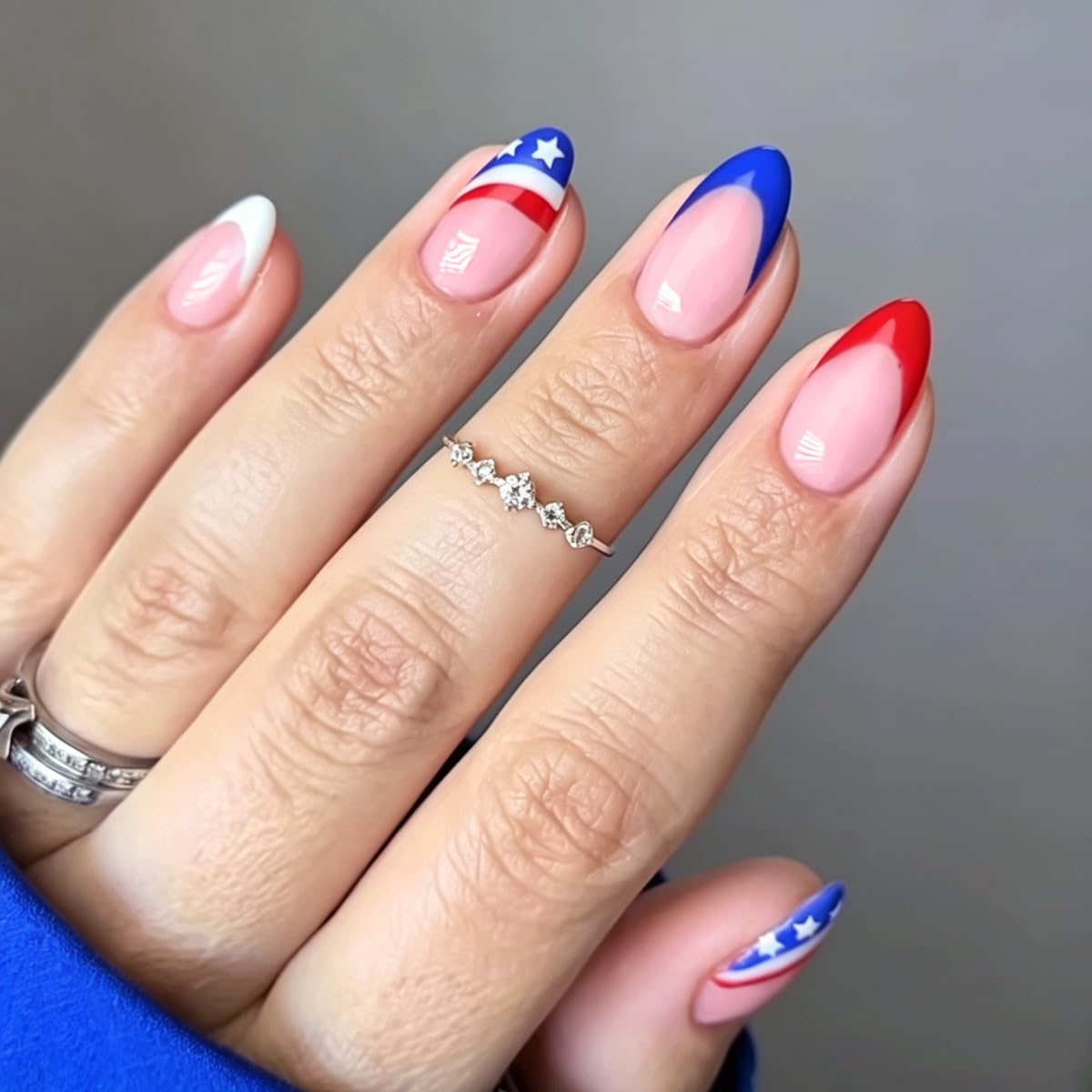 FJSMTOPl front set showing American flag nails and French tips for bold holiday style