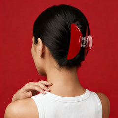 FlaSloth cherry red clip worn in hair showing secure hold and effortless style benefit