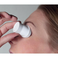Flents eye wash cup in use demonstrating leak-free flush and gentle eye protection benefit