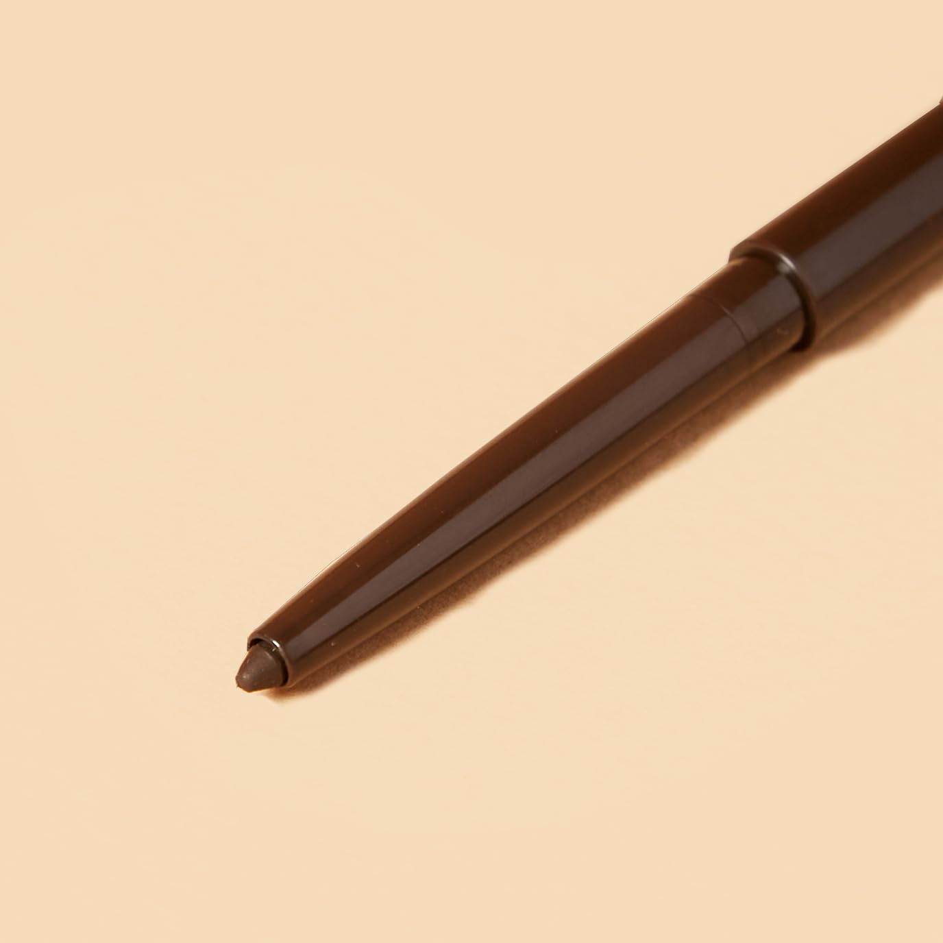 FLOWER Beauty pencil tip close-up showing smooth texture for precise application benefit