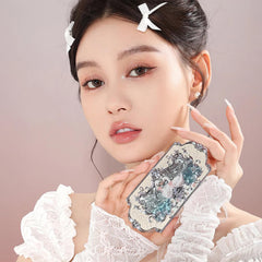 Flower Knows engraved swan and skirt detail highlighting decorative compact art