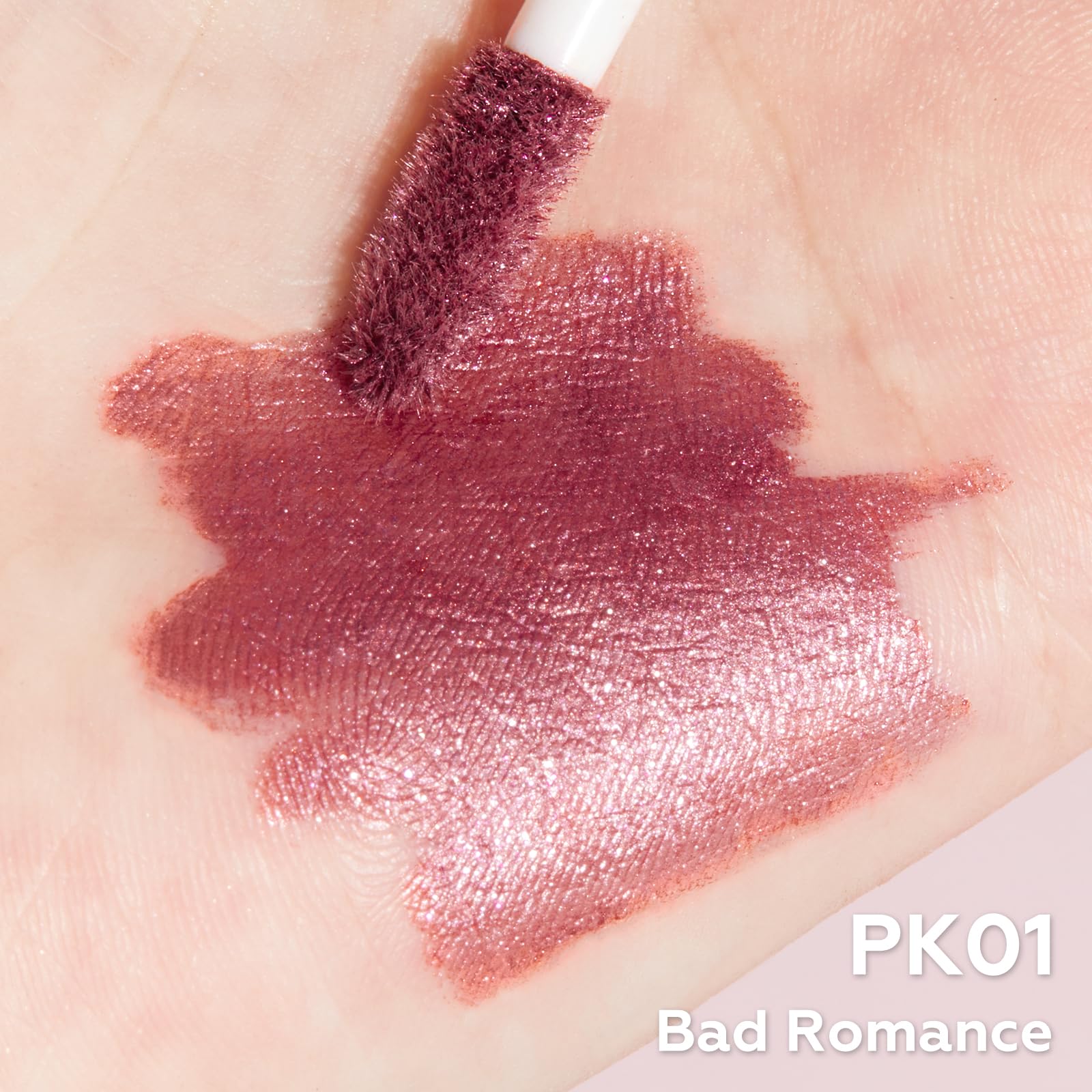 FOCALLURE arm swatches showing Bad Romance metallic payoff and blendability