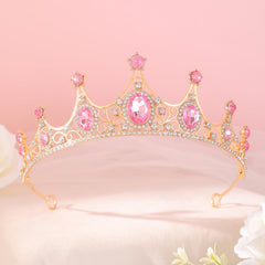 FORSEVEN tiara beside ruler showing approximately 2 inch height and scale