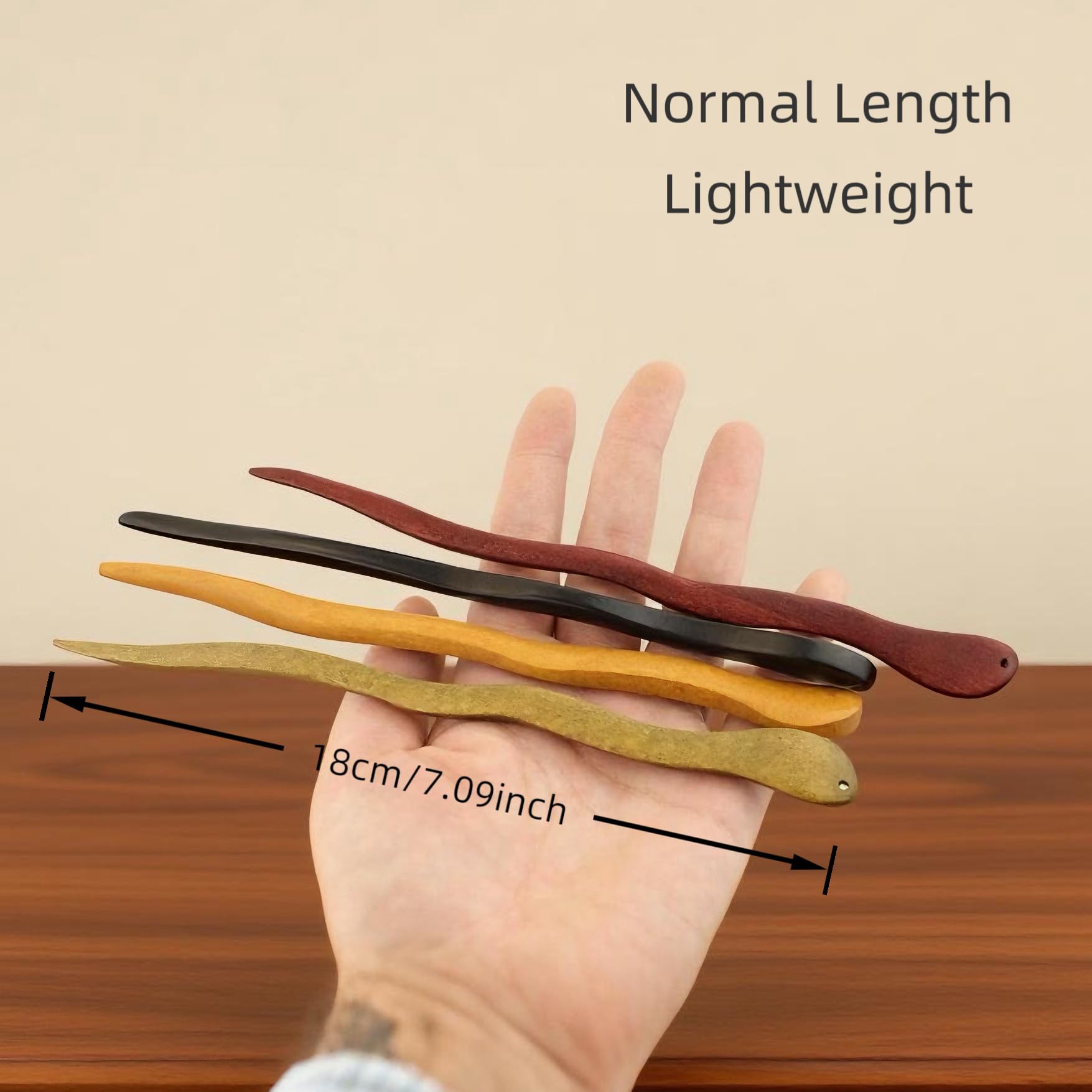 Fosrisix hair stick held in hand showing 7 inch scale for length and control