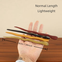Fosrisix hair stick held in hand showing 7 inch scale for length and control