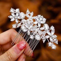 Foyte front view of comb showing floral silver design and wearable elegance