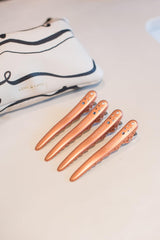 FRAMAR clips securing foil during color application for steady results