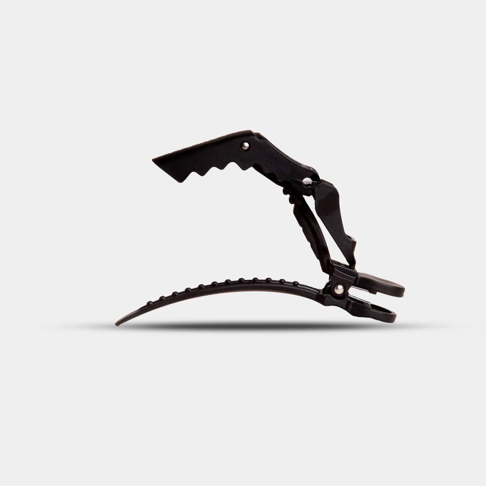 FRAMAR clip held in hand displaying size and ergonomic hold advantage