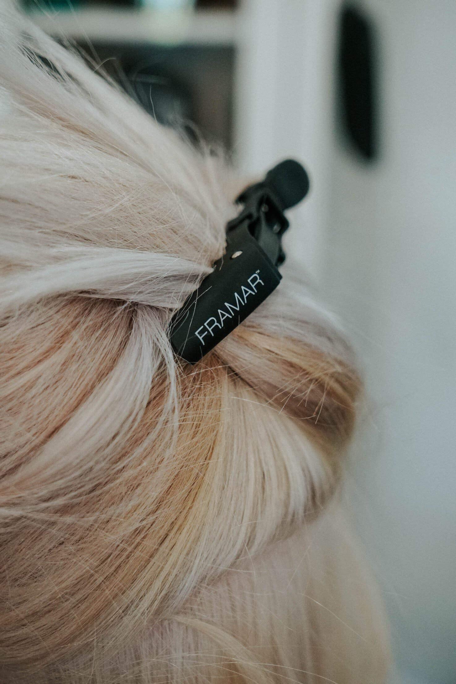 FRAMAR clips on salon counter with tools showing professional workflow ease