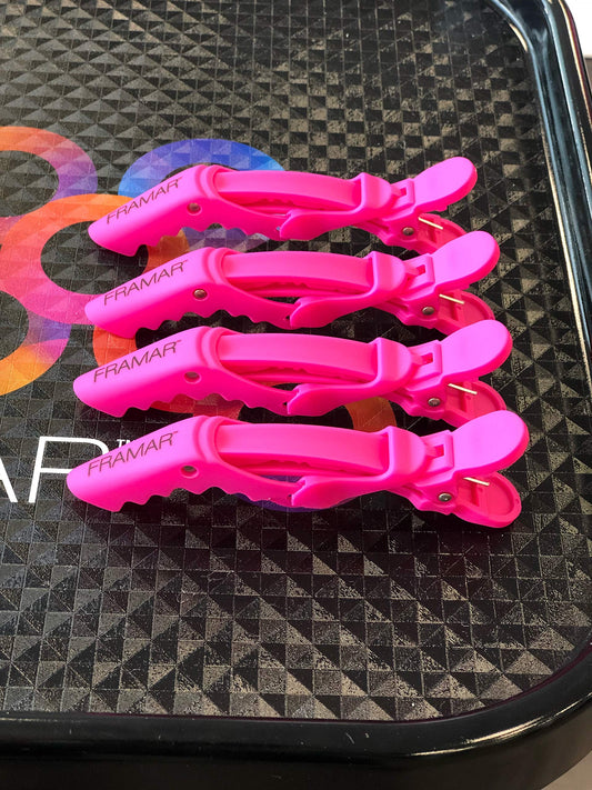 FRAMAR clip shown open and closing demonstrating reliable grip benefit