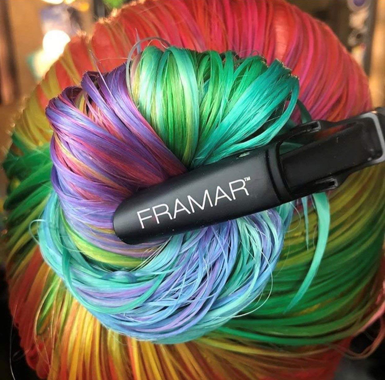 FRAMAR clip sectioning a thick hair chunk to demonstrate wide opening