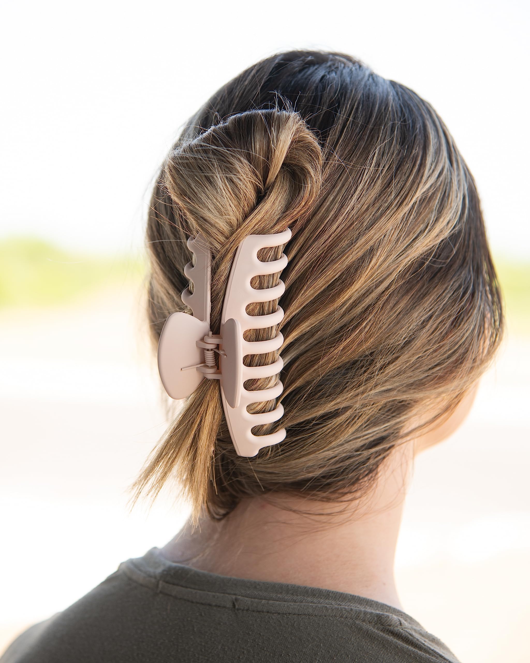 FRAMAR clip in use holding a high ponytail for all-day comfort