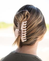 FRAMAR clip in use holding a high ponytail for all-day comfort