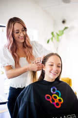 FRAMAR clips clipped into hair on salon chair aiding precise styling