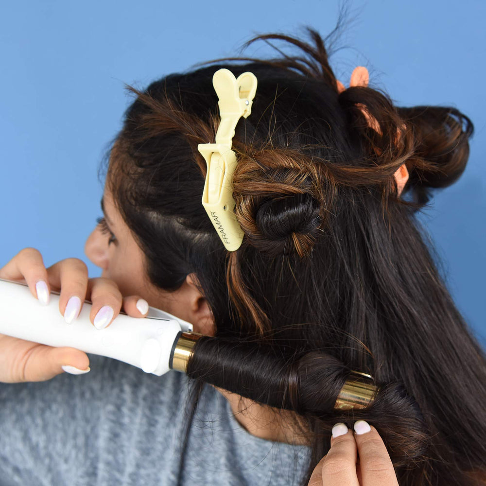 FRAMAR clips in hand showing compact size and easy portability