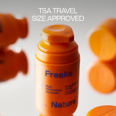 Freaks of Nature tube beside coin showing 1.7 oz travel-friendly size