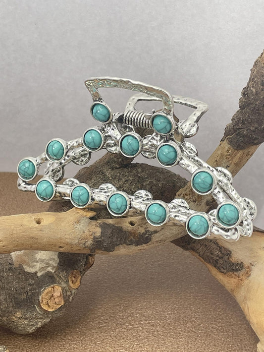 Frinnovan front view of turquoise hair claw clip, shows style and easy wear benefit