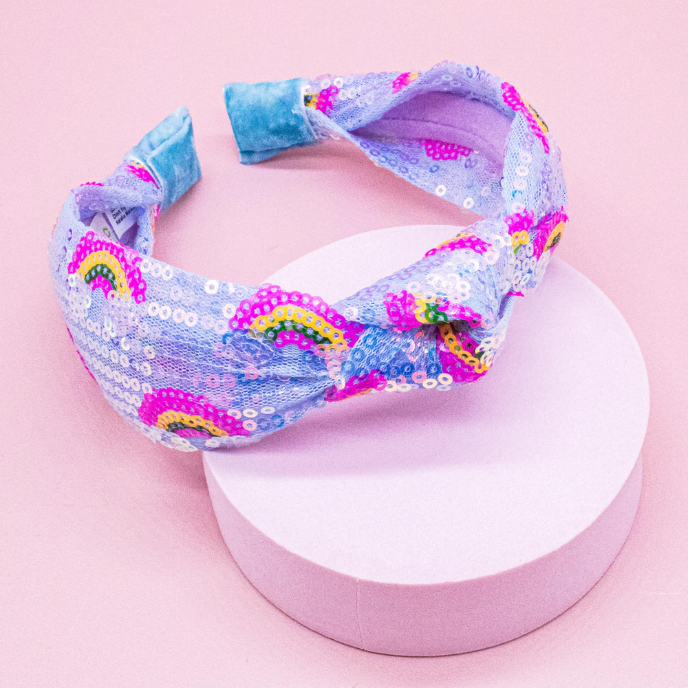 FROG SAC headband worn by child keeping hair back and adding playful sparkle